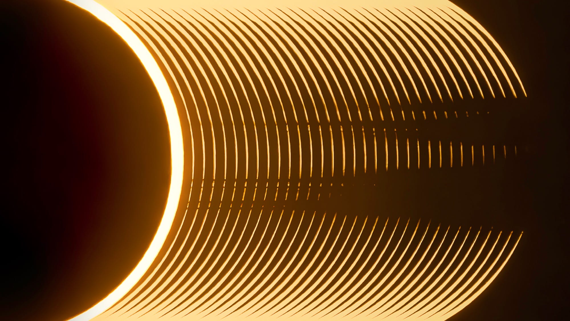 an abstract image of the sun with glowing rings that appear to grow from the right side