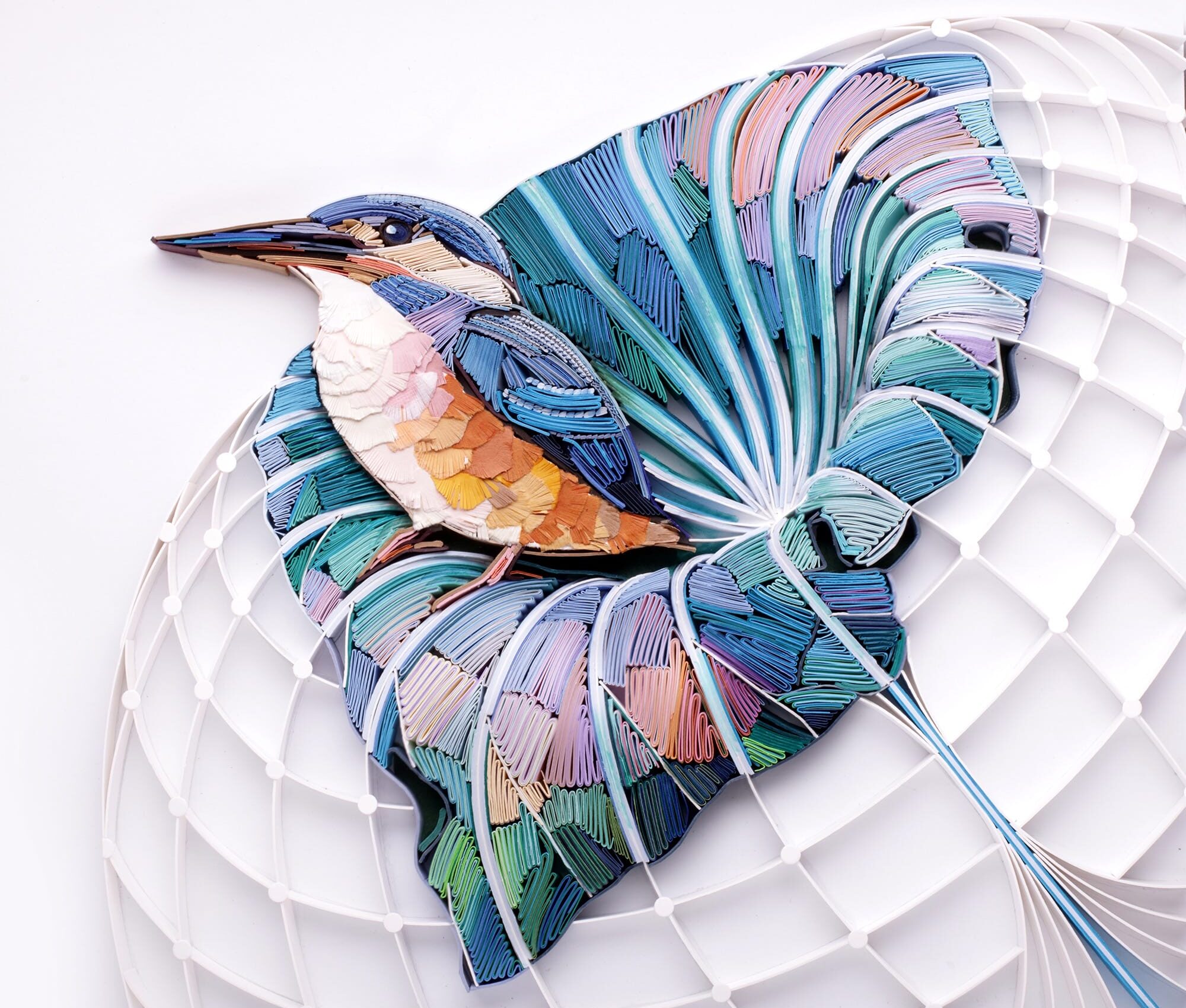 a quilled paper sculpture of a kingfisher in a leaf