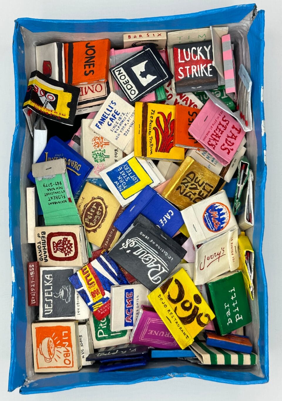 a paper mache sculpture of a box of branded matches