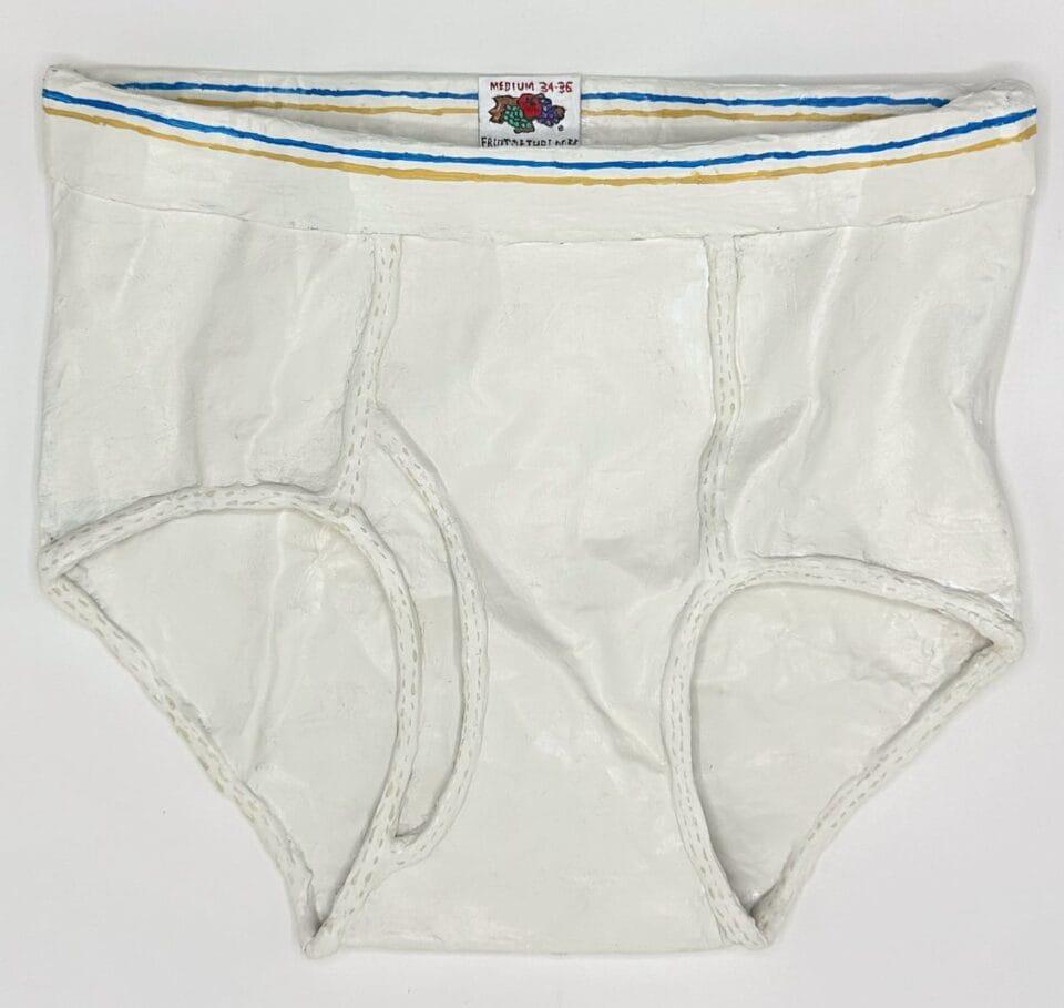 a paper mache sculpture of white brief underwear