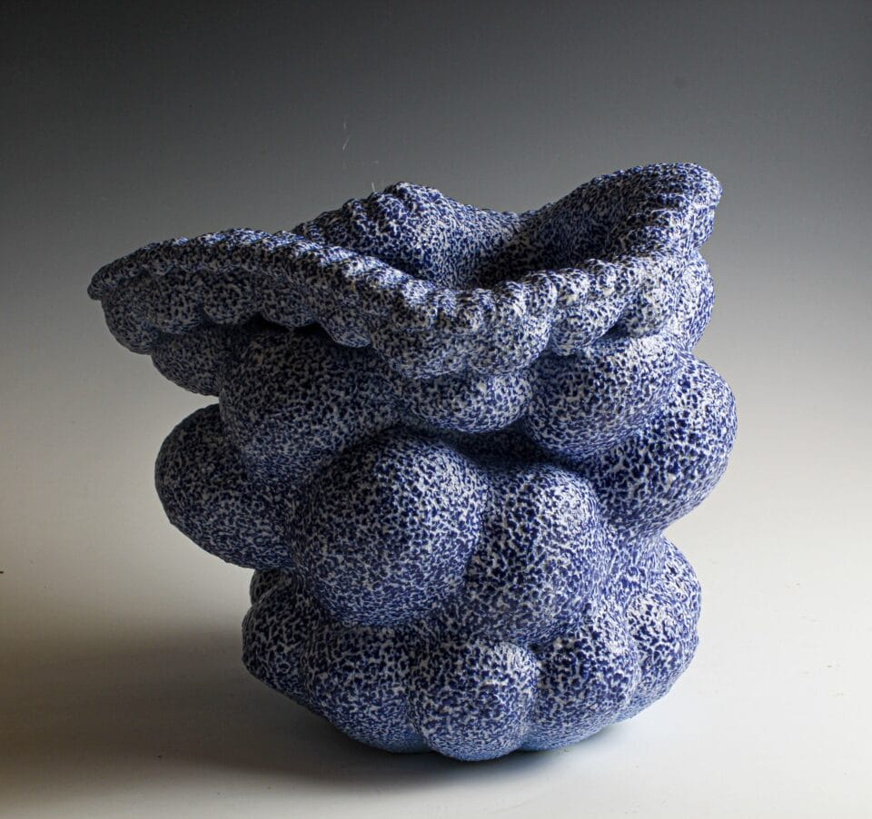 an abstract, globular ceramic vessel in grayish-blue