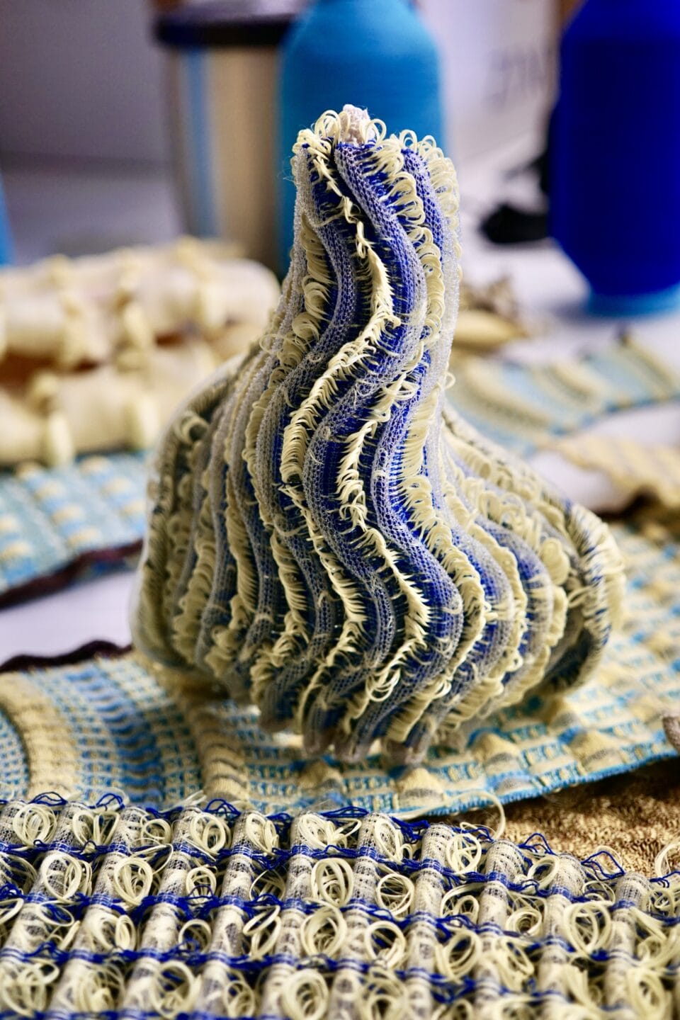 a sculptural form made from woven fabric