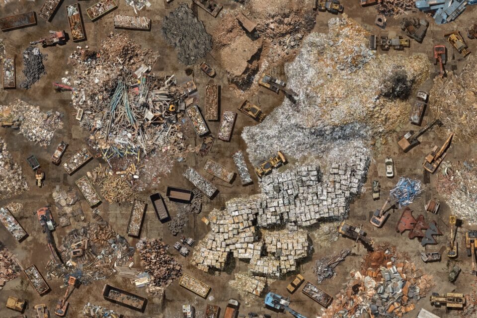 a very detailed digitally created aerial composite image of numerous scrap metal yards